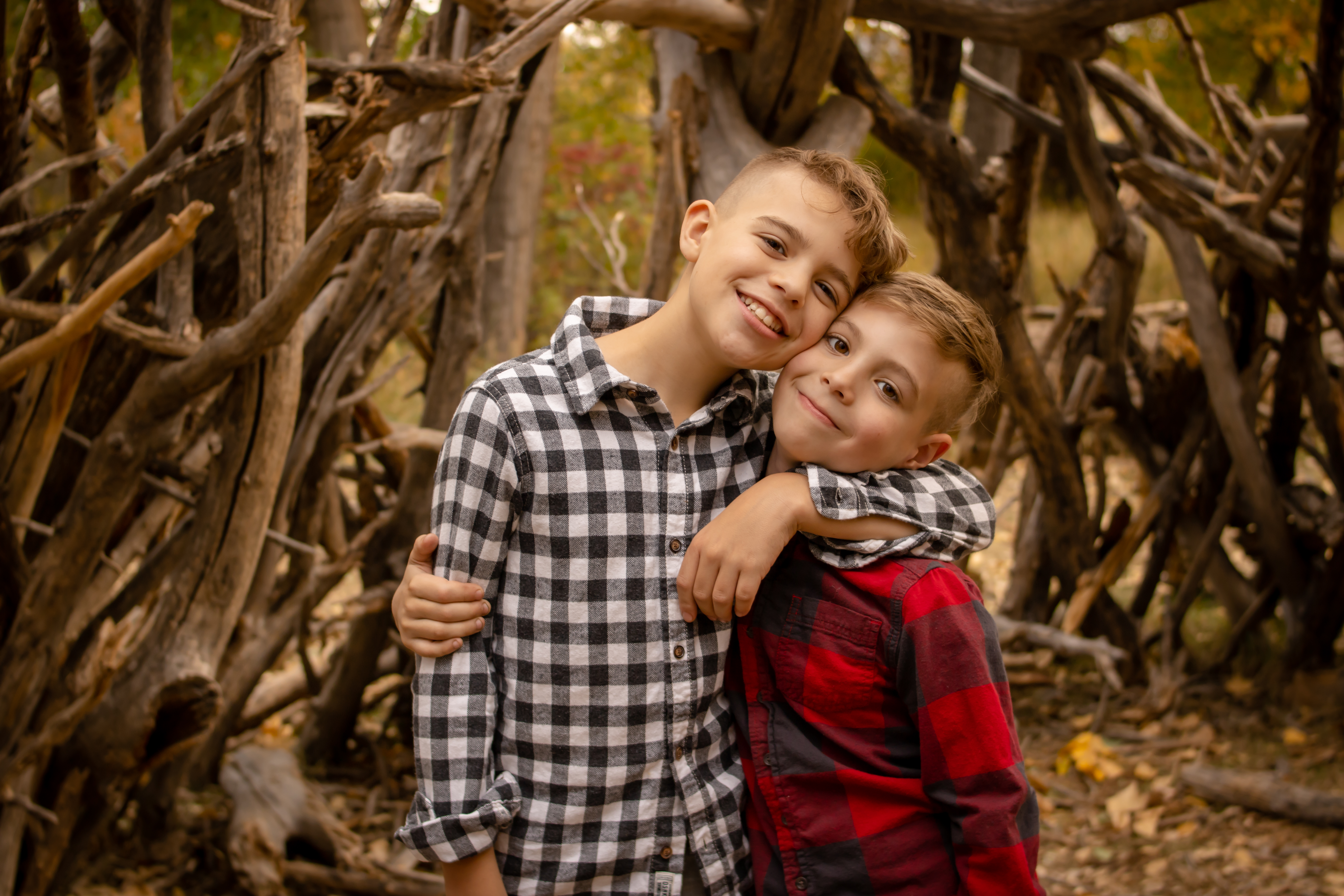 Two brothers hug during a family photo session